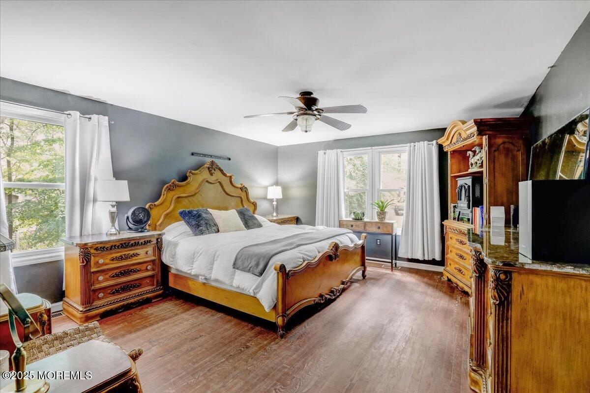 165 Cassville Road Jackson, NJ 08527 - Photo 14 of 24 a bedroom with a bed and a flat screen tv