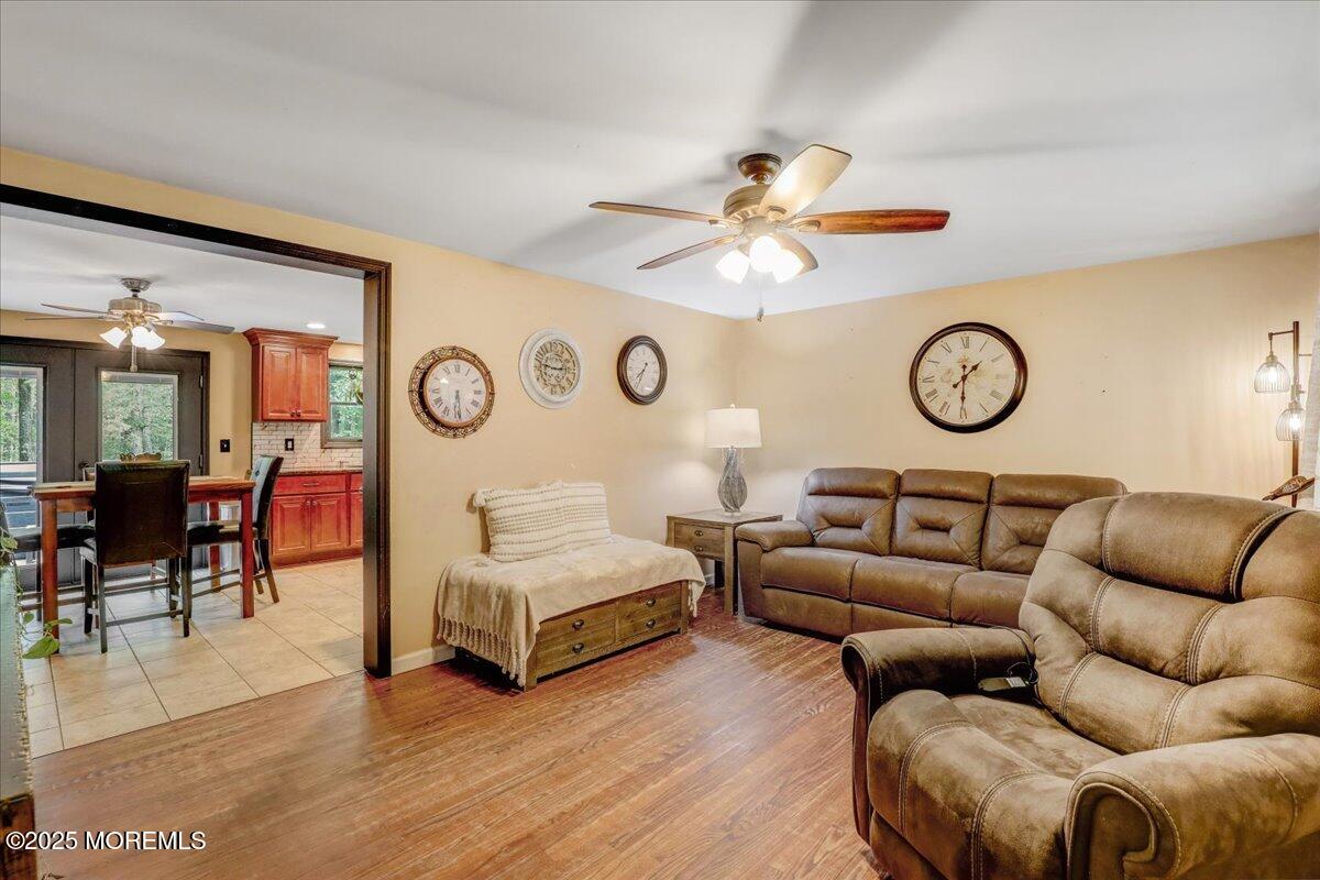 165 Cassville Road Jackson, NJ 08527 - Photo 4 of 24 a living room with furniture and a large window