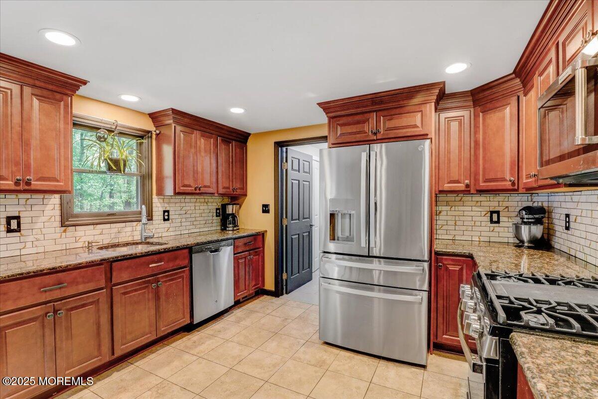 165 Cassville Road Jackson, NJ 08527 - Photo 7 of 24 a kitchen with stainless steel appliances granite countertop a refrigerator stove and sink