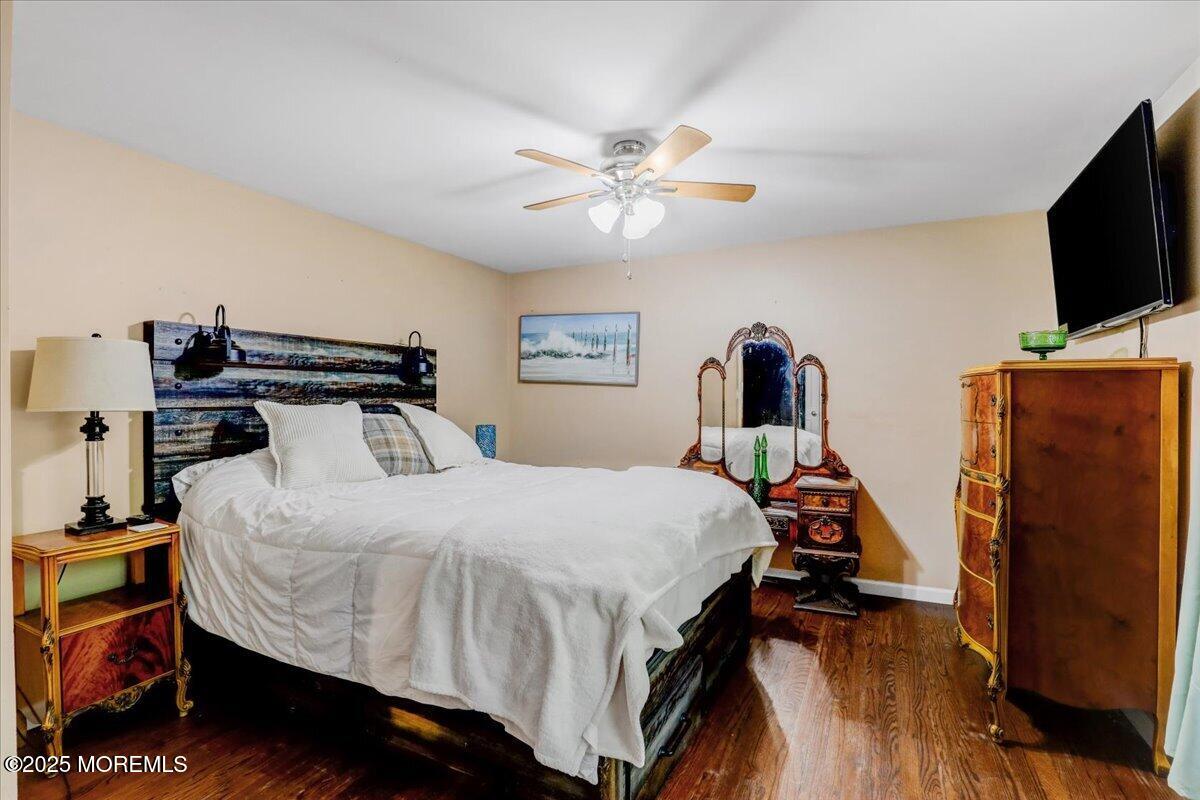 165 Cassville Road Jackson, NJ 08527 - Photo 10 of 24 a bedroom with a bed and a flat screen tv