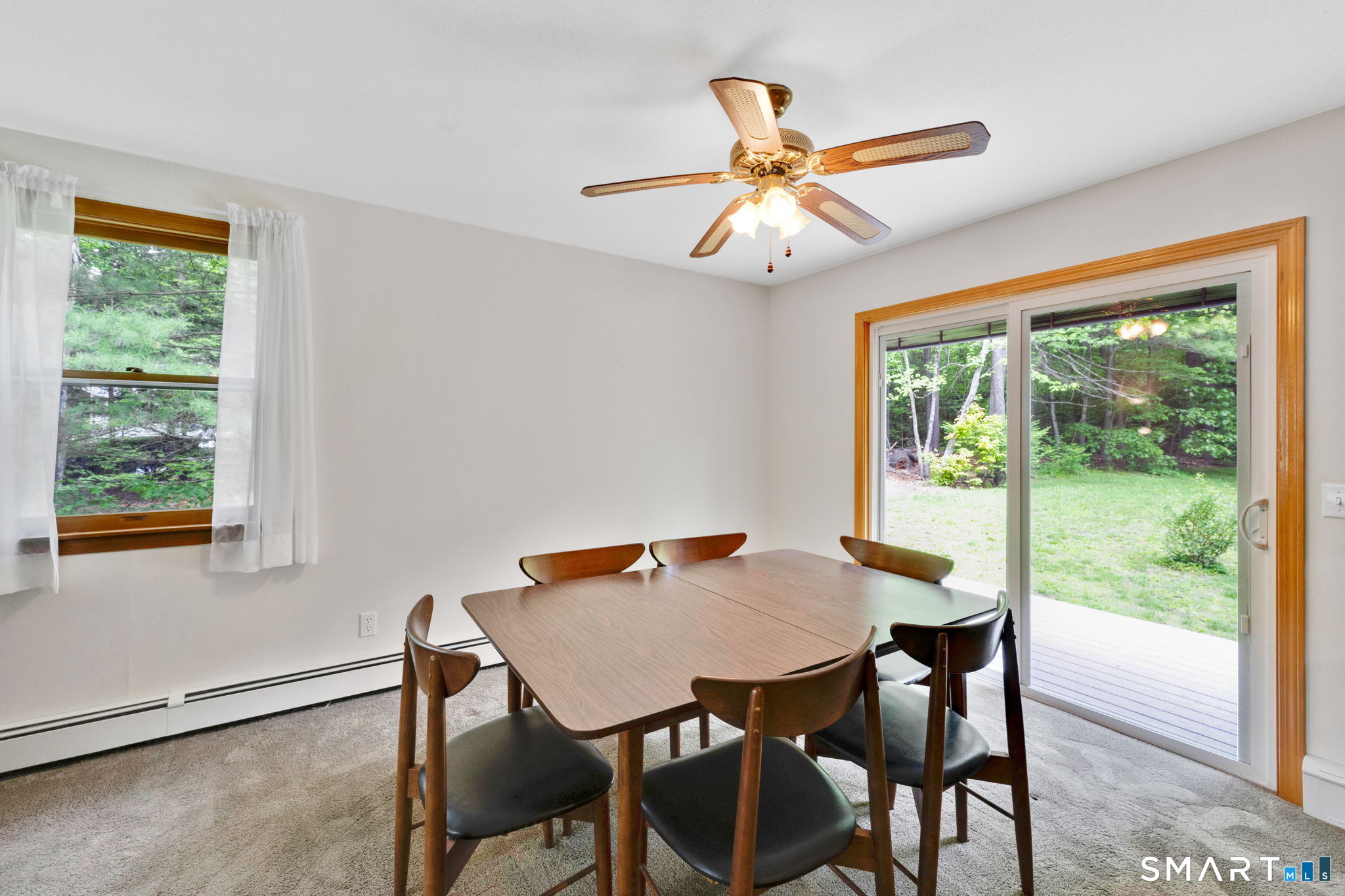 158 Notch Road Granby, CT 06035 - Photo 9 of 40 a view of a dining room with furniture window and outside view