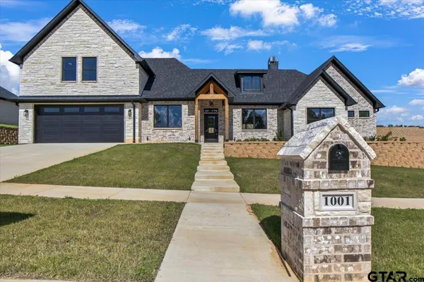a front view of a house with yard