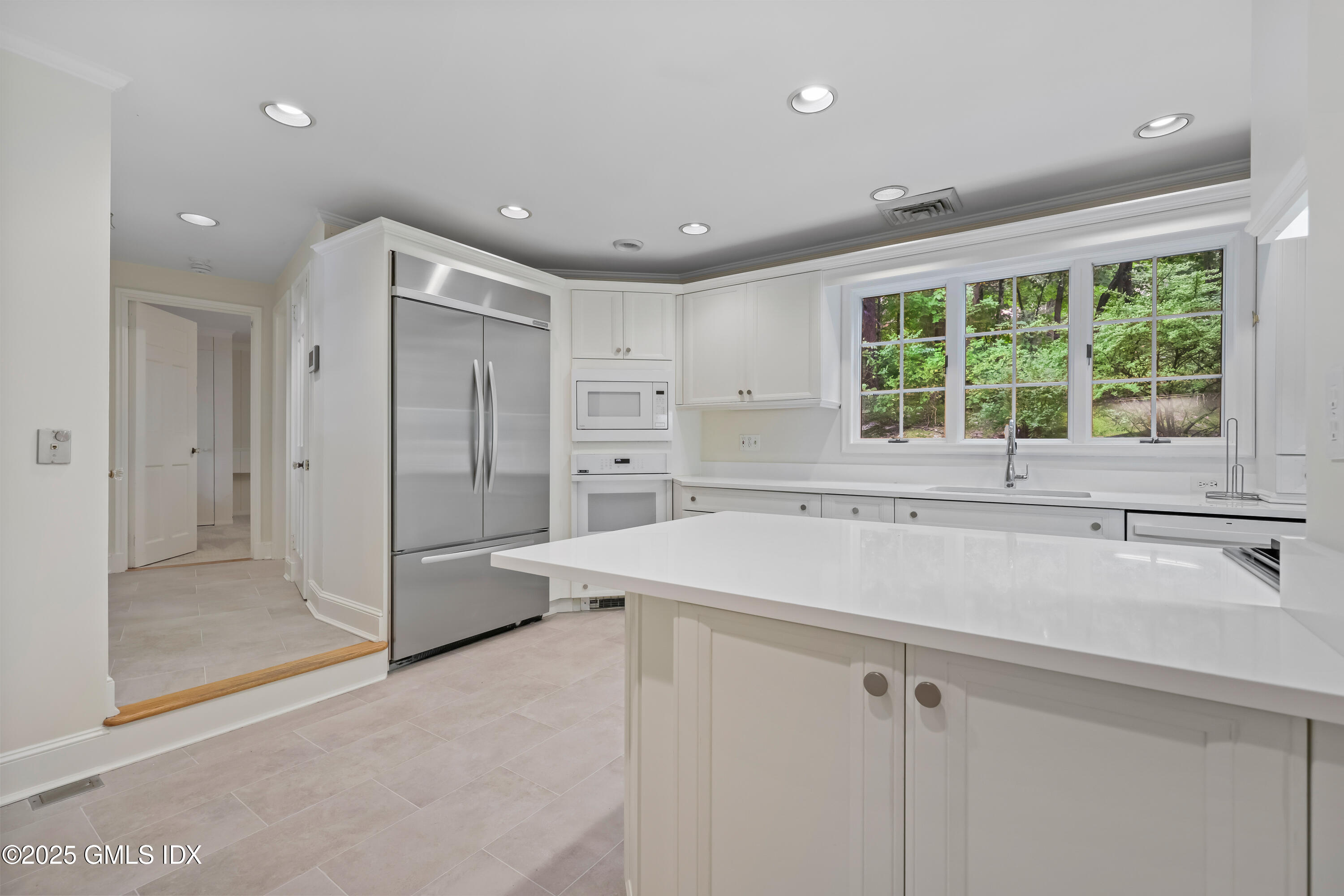 320 Cognewaugh Road Cos Cob, CT 06807 - Photo 12 of 27 a kitchen with a sink and large window