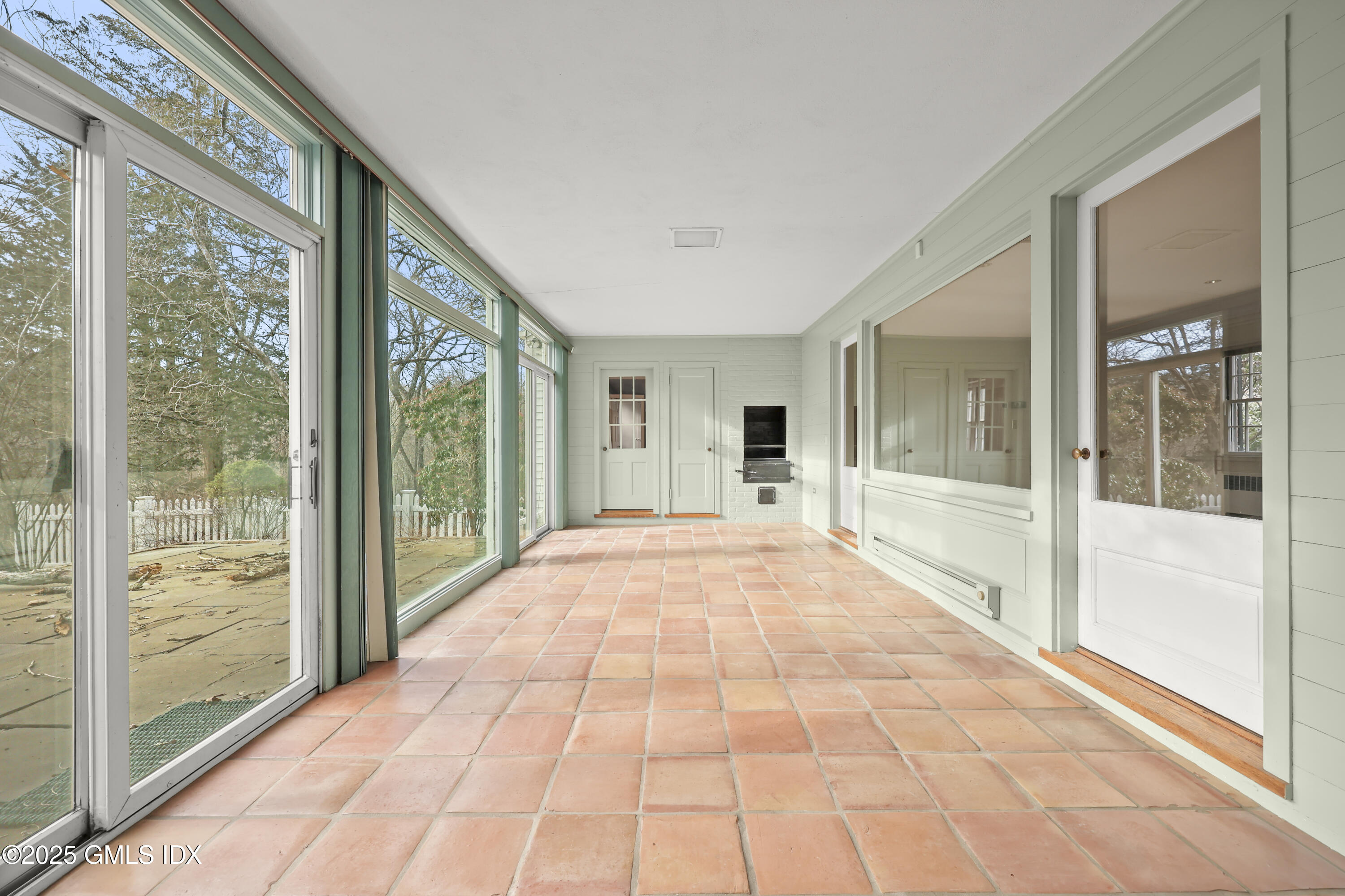 320 Cognewaugh Road Cos Cob, CT 06807 - Photo 16 of 27 a big room with wooden floor and windows