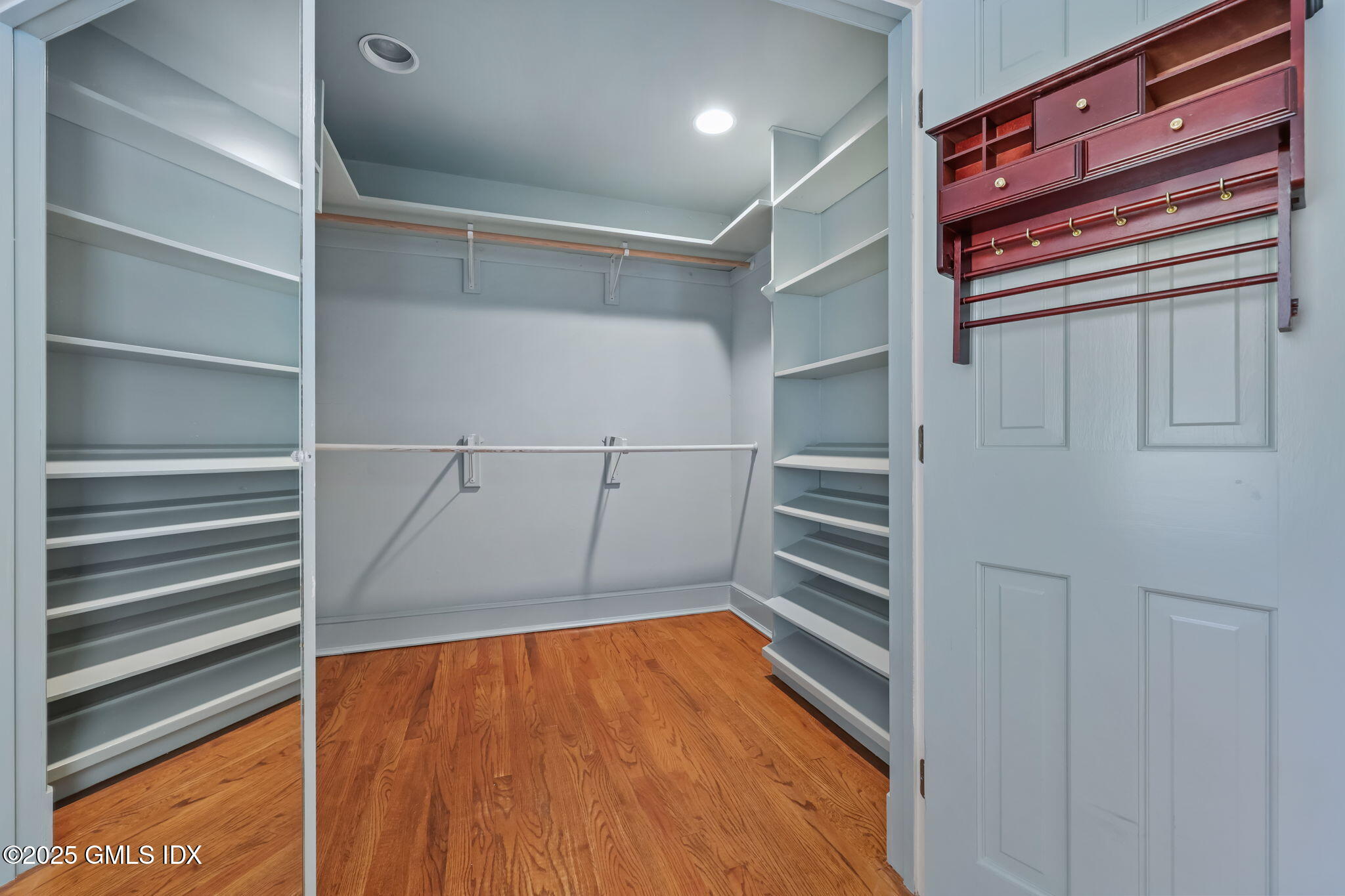 320 Cognewaugh Road Cos Cob, CT 06807 - Photo 18 of 27 a view of walk in closet with empty racks