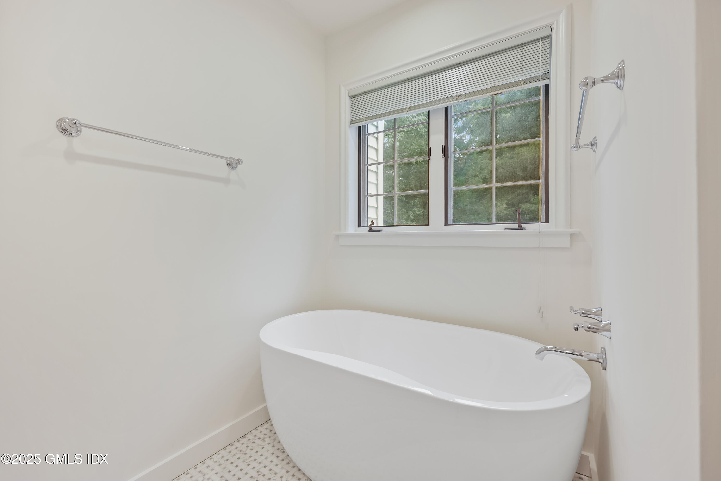 320 Cognewaugh Road Cos Cob, CT 06807 - Photo 19 of 27 a white bath tub sitting next to a window