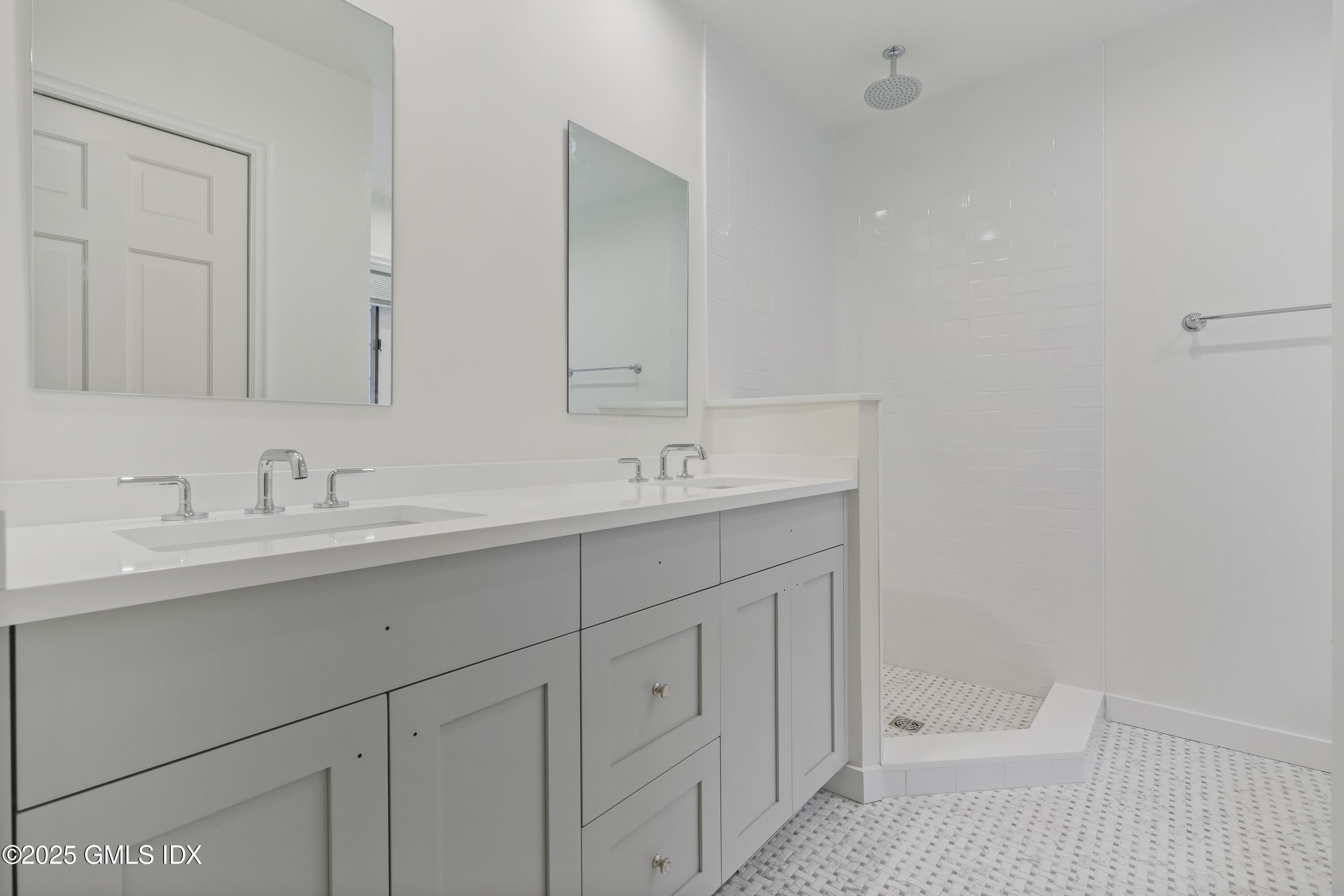 320 Cognewaugh Road Cos Cob, CT 06807 - Photo 20 of 27 a bathroom with a sink and a mirror