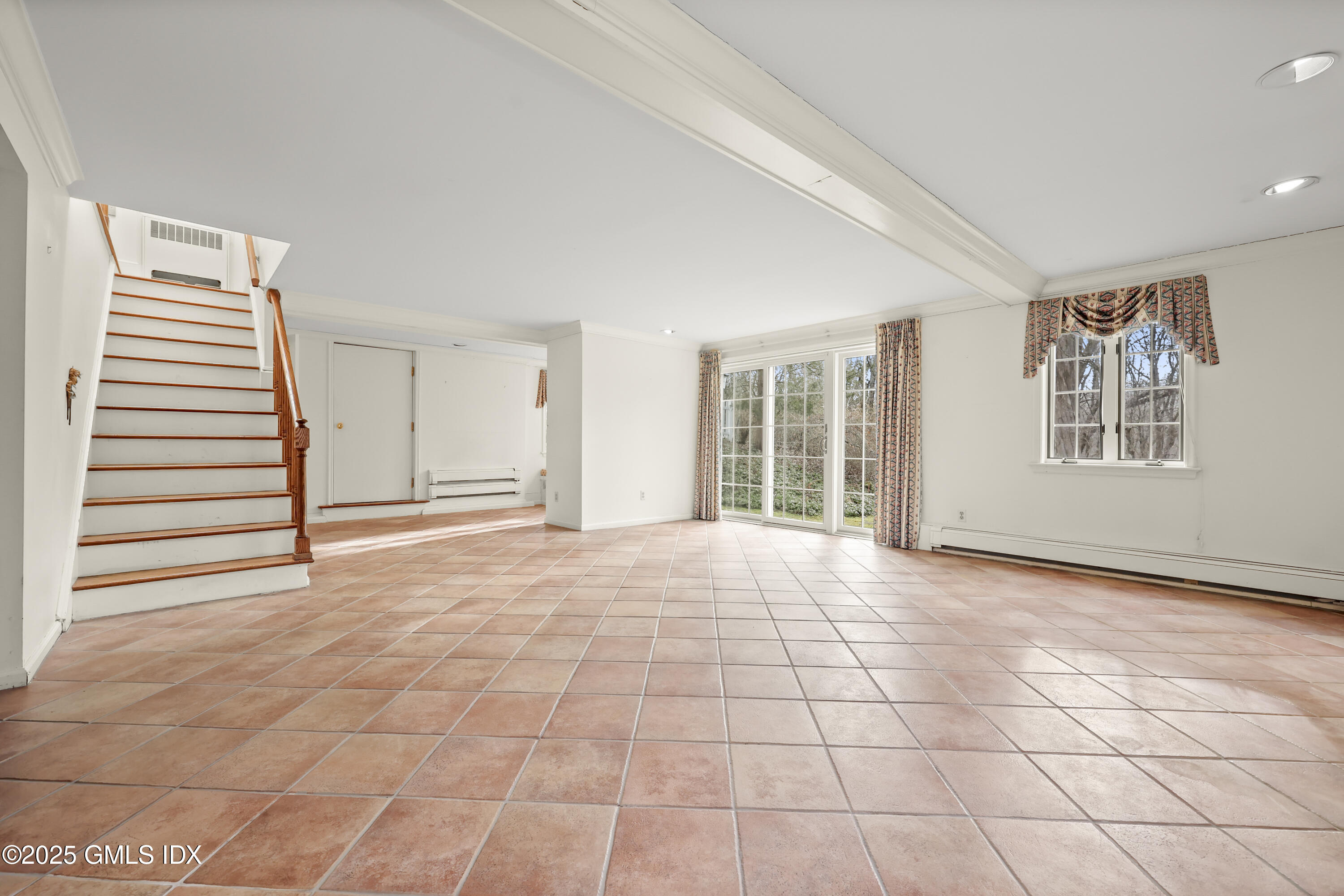 320 Cognewaugh Road Cos Cob, CT 06807 - Photo 22 of 27 a view of an empty room with a window