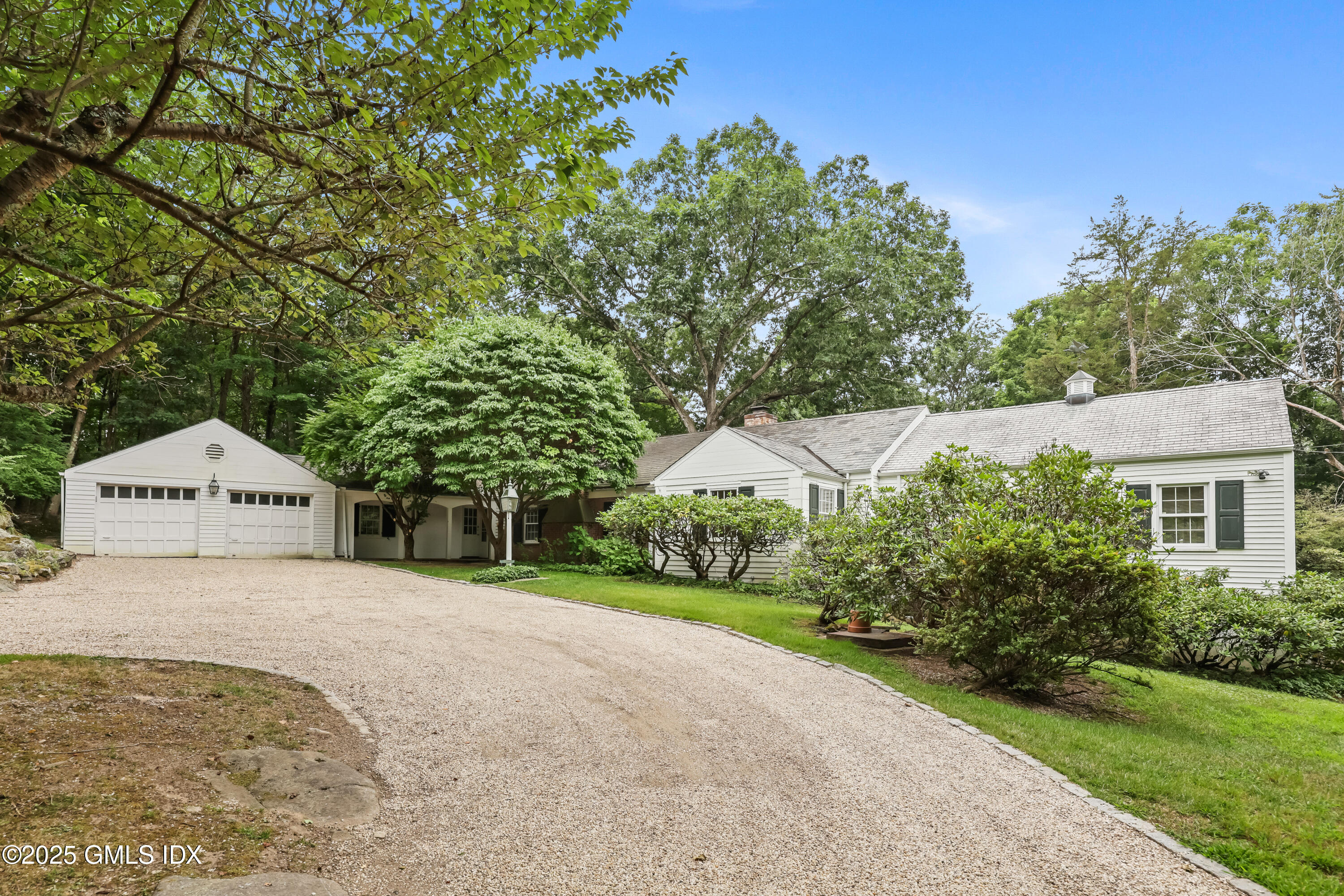 320 Cognewaugh Road Cos Cob, CT 06807 - Photo 7 of 27 a view of a house with a yard and tree s