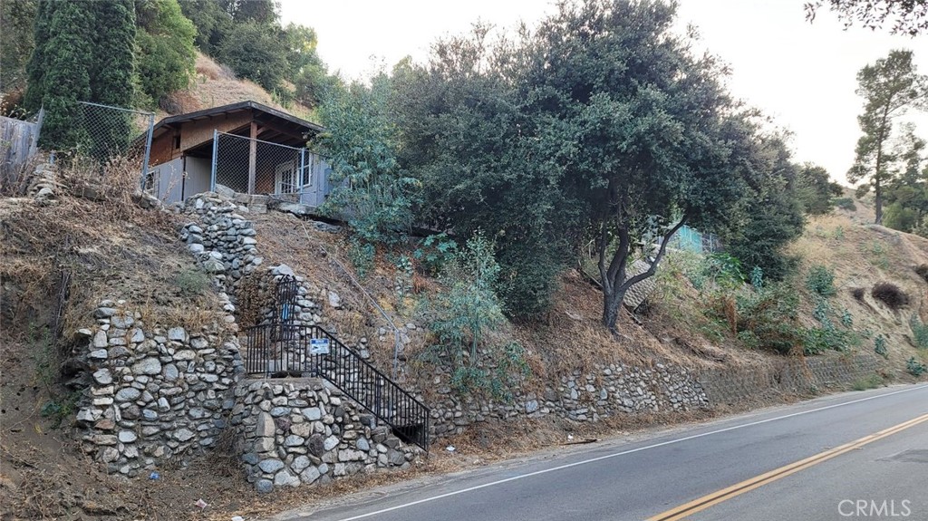 12047 Kagel Canyon Road Sylmar, CA 91342 - Photo 4 of 14 a view of a house with a yard