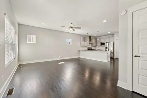 a view of a kitchen with a sink and a window