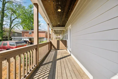 a view of balcony with wooden floor