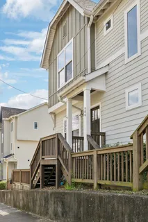 a view of a house with a small yard
