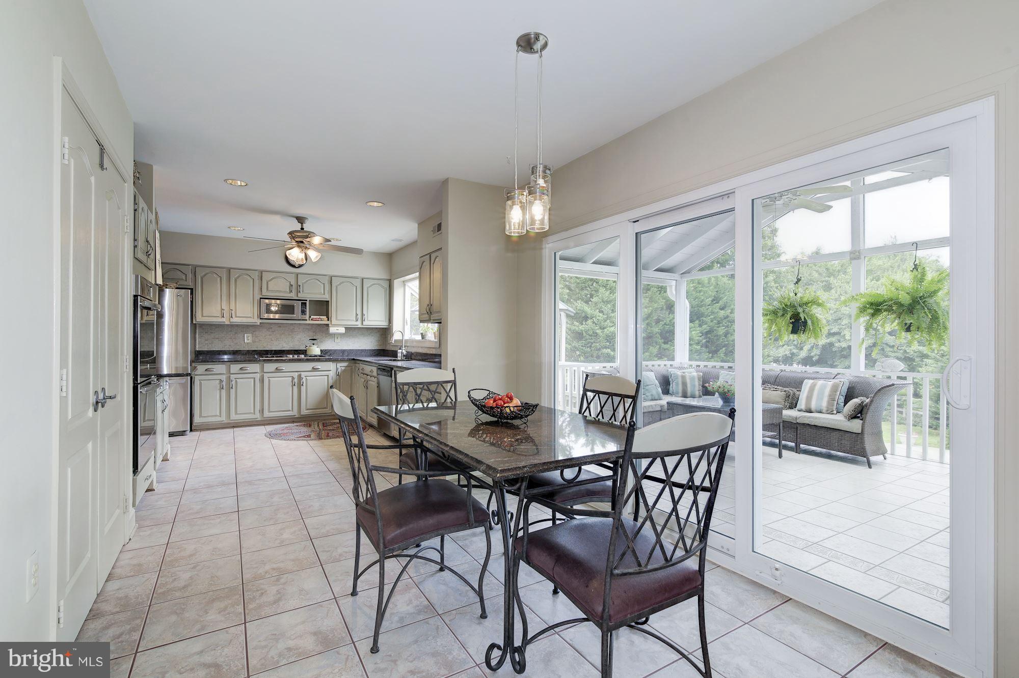 19613 Bruner Way Poolesville, MD 20837 - Photo 10 of 30 Breakfast area out to the screened Porch!
