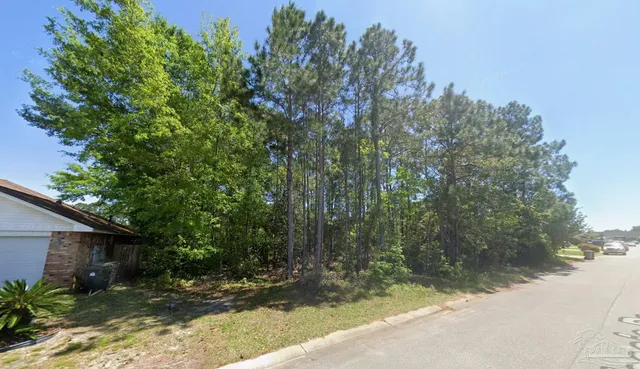 a backyard of a house with lots of green space
