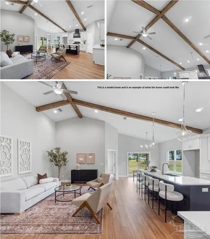 a living room with lots of furniture and kitchen view