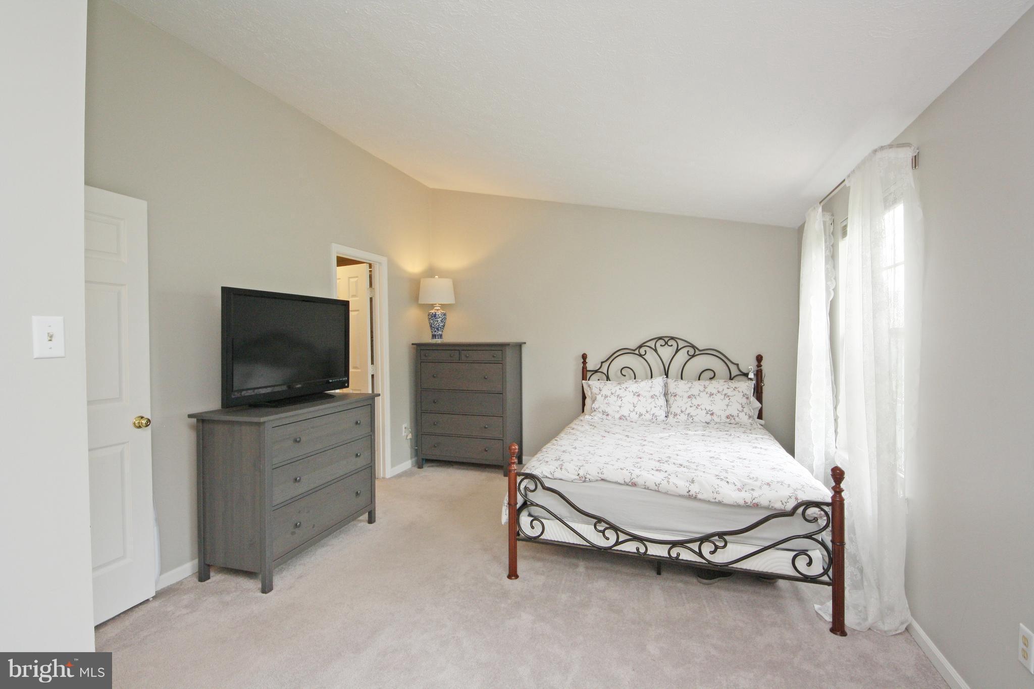 2152 Cedar Barn Way Baltimore, MD 21244 - Photo 12 of 29 a living room with furniture and a flat screen tv