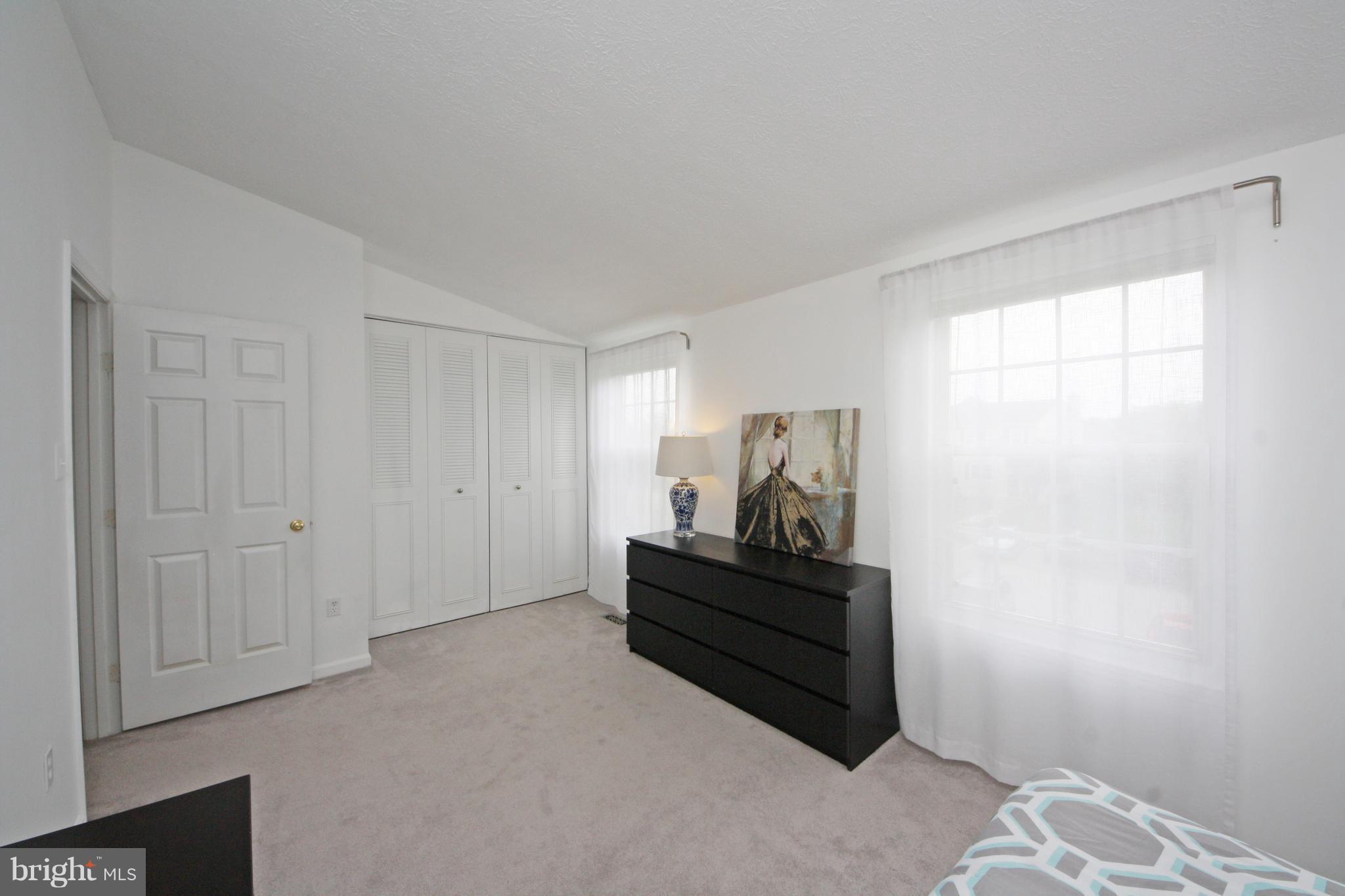 2152 Cedar Barn Way Baltimore, MD 21244 - Photo 18 of 29 a room with a bed and a window