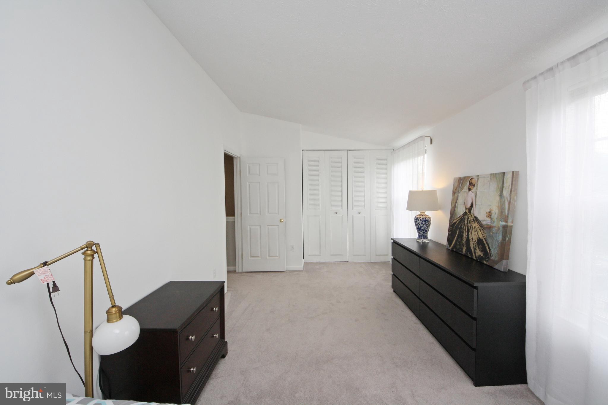 2152 Cedar Barn Way Baltimore, MD 21244 - Photo 20 of 29 a living room with furniture and a flat screen tv