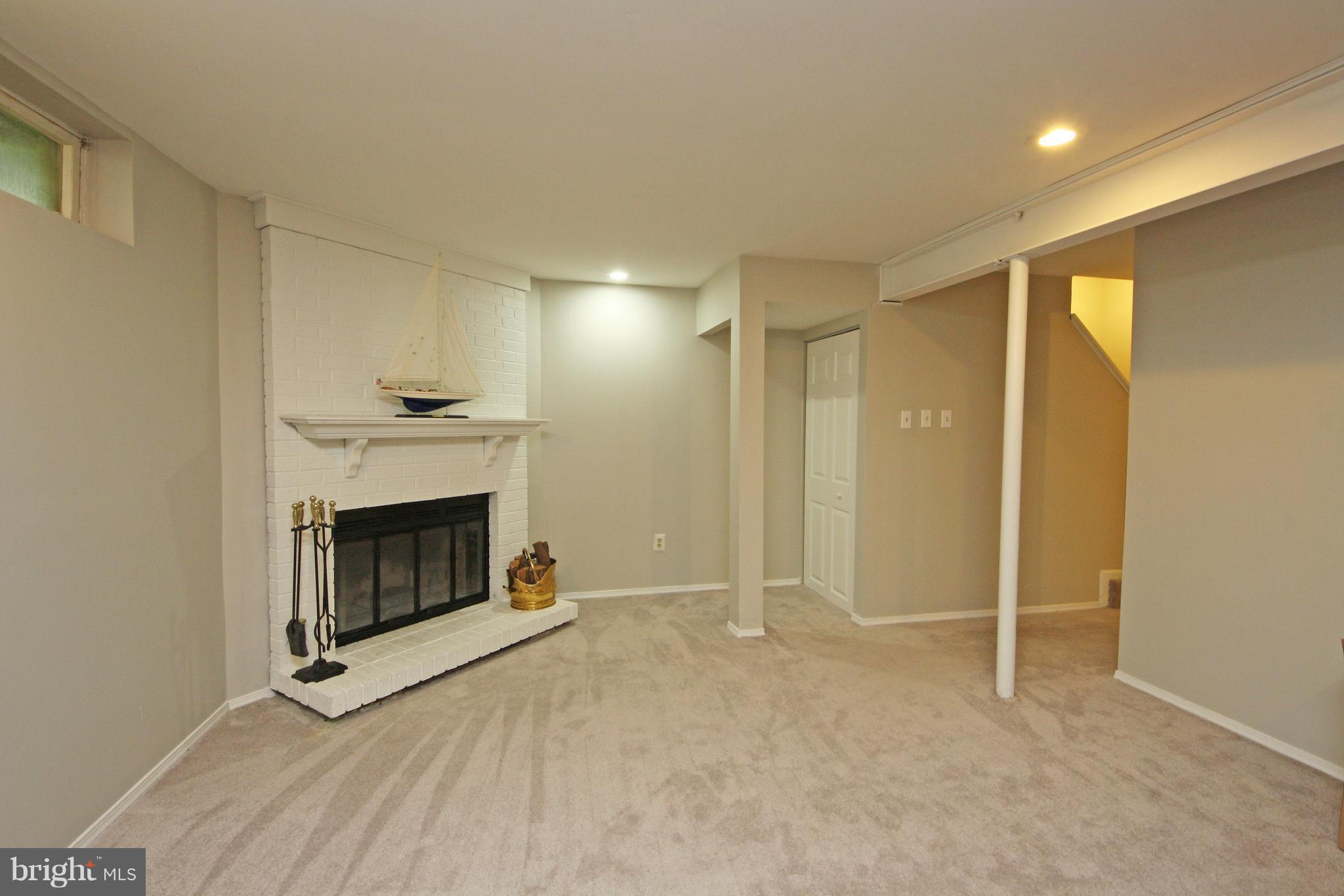 2152 Cedar Barn Way Baltimore, MD 21244 - Photo 21 of 29 a view of an empty room with fire place and a window