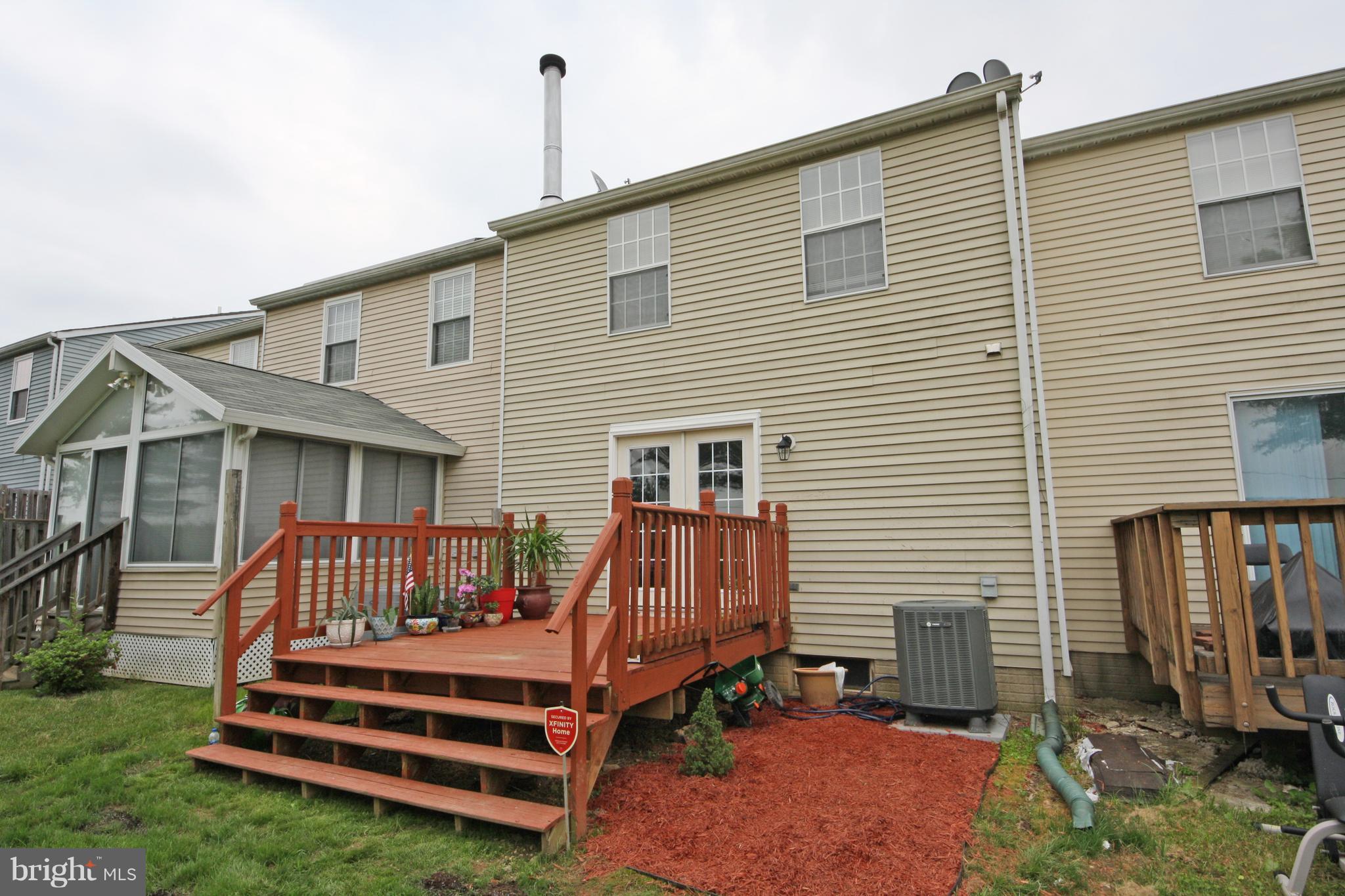 2152 Cedar Barn Way Baltimore, MD 21244 - Photo 27 of 29 a front view of a house with a yard