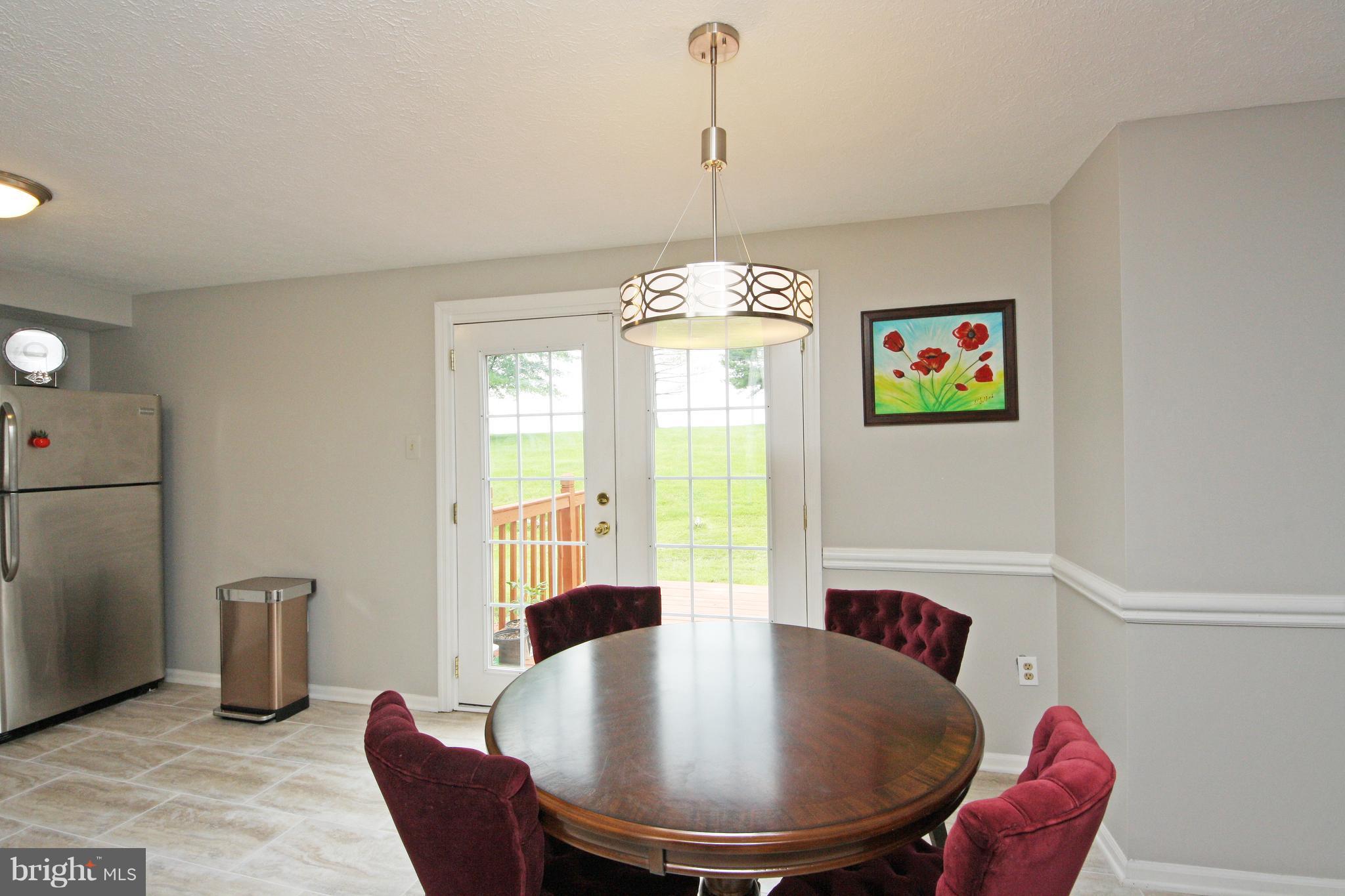 2152 Cedar Barn Way Baltimore, MD 21244 - Photo 6 of 29 a dining room with furniture and window