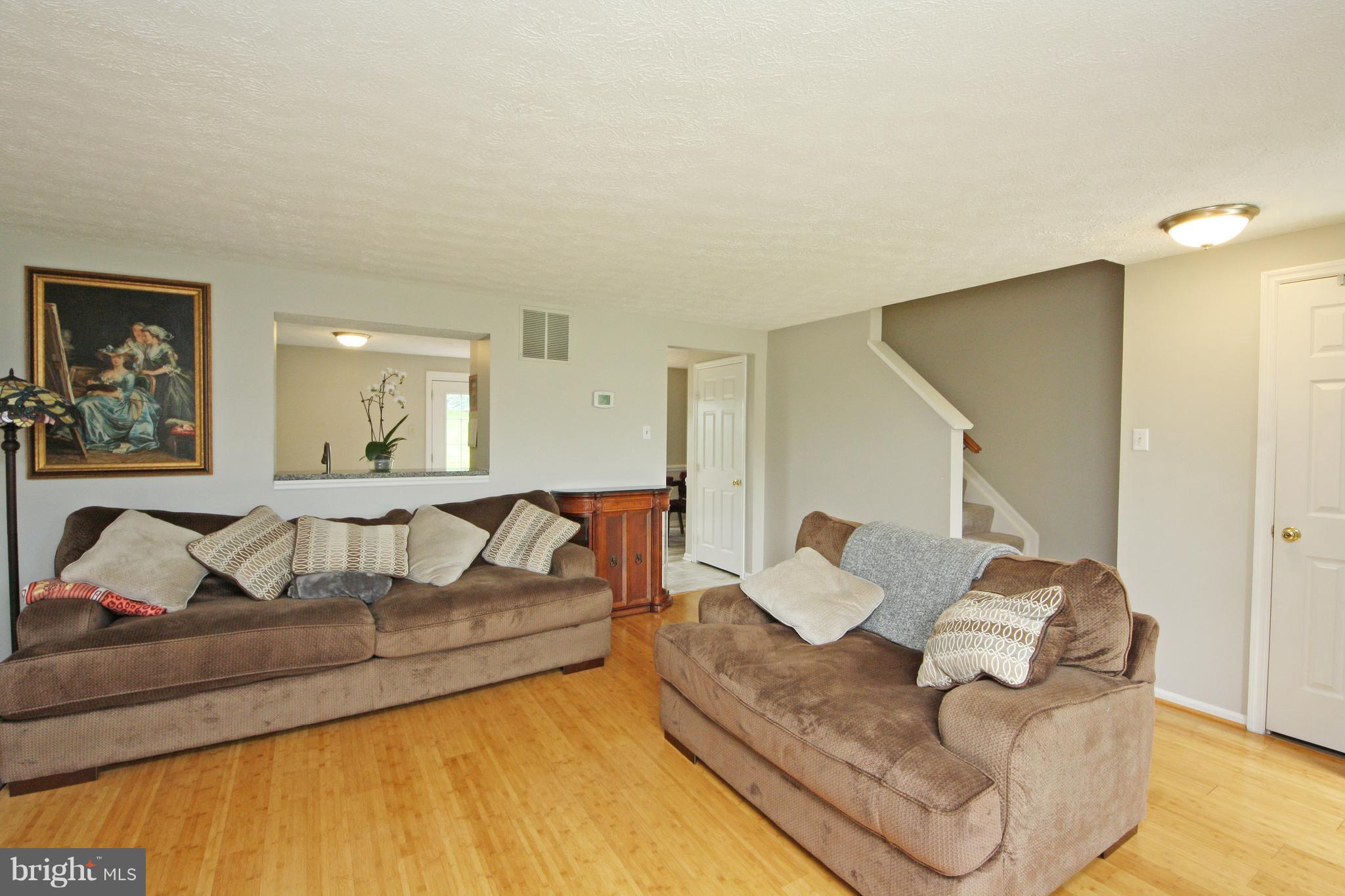 2152 Cedar Barn Way Baltimore, MD 21244 - Photo 8 of 29 a living room with furniture and wooden floor