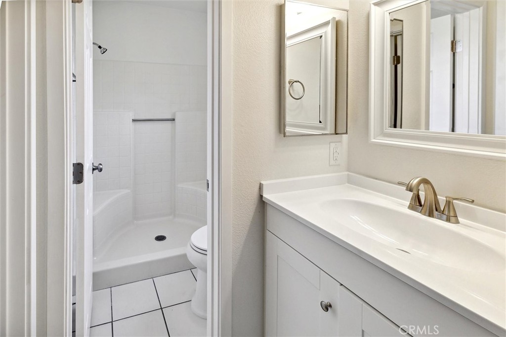 5153 Loma Verde Oceanside, CA 92056 - Photo 12 of 18 a bathroom with a sink and a mirror