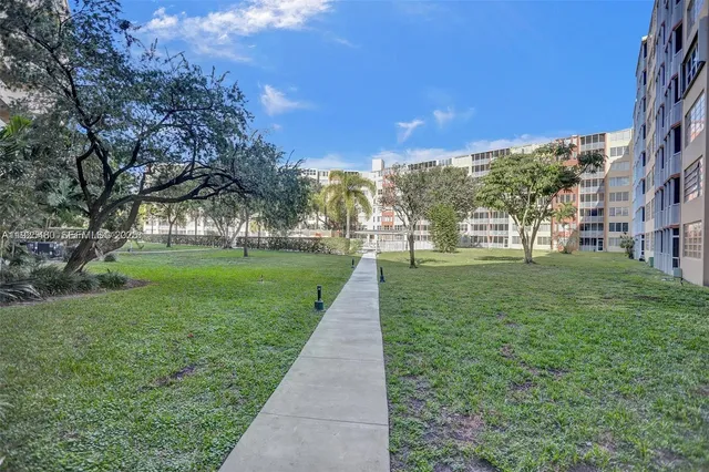 a view of a park with large trees