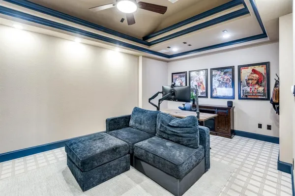 a living room with furniture and a chandelier