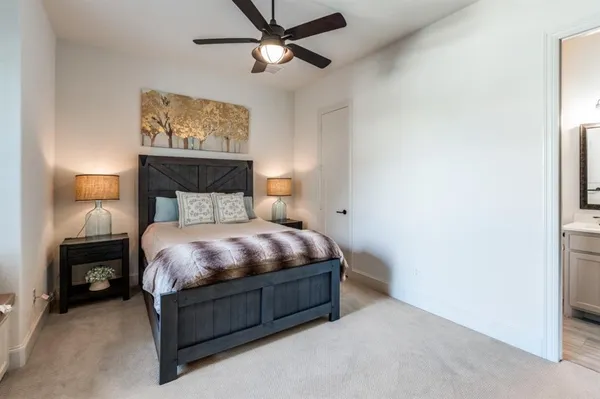 a bed sitting in a bedroom next to a window