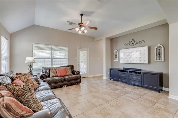 a living room with furniture and a window