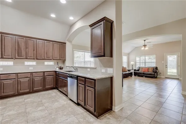 a kitchen with sink and cabinets