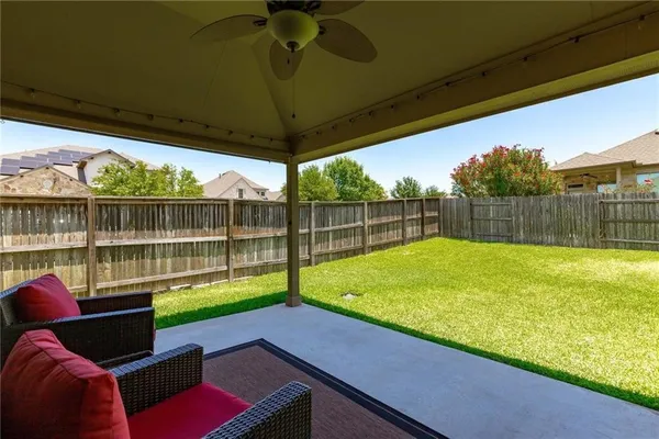a view of a backyard with a swimming pool