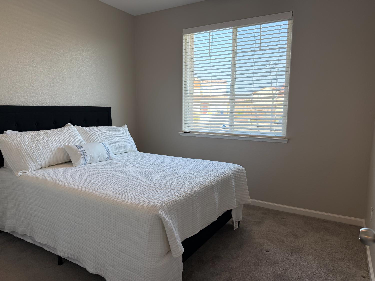 826 Courtney Court Merced, CA 95348 - Photo 8 of 8 a bedroom with a bed and window