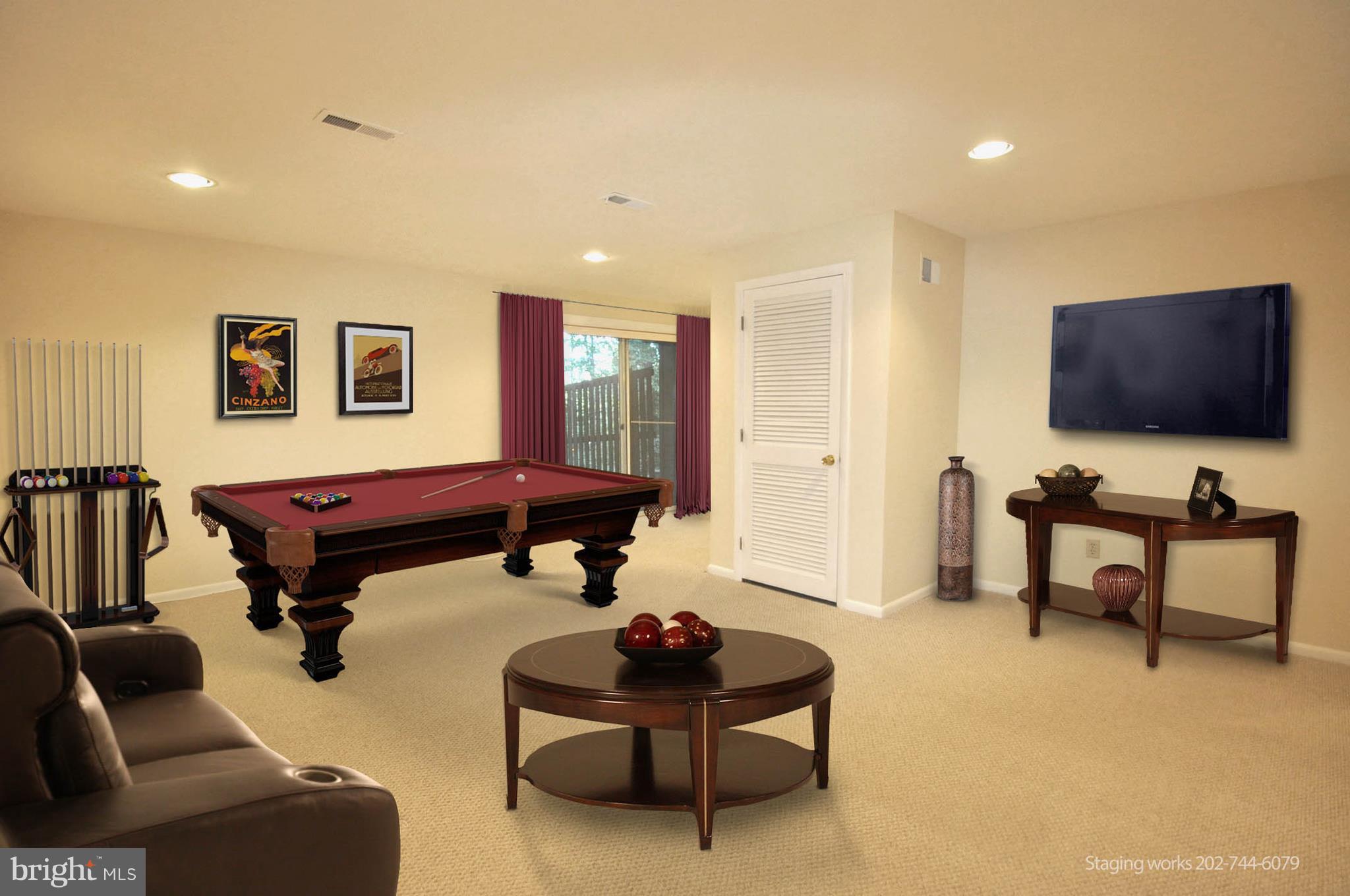 9125 Saffron Lane Silver Spring, MD 20901 - Photo 11 of 18 a living room with furniture and a flat screen tv