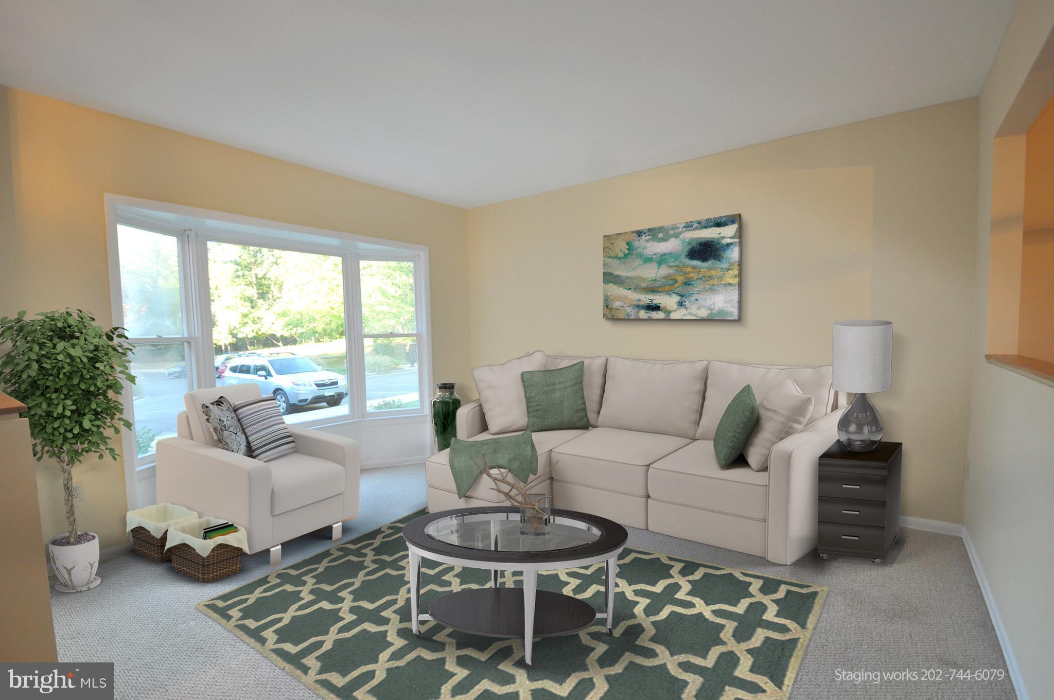 9125 Saffron Lane Silver Spring, MD 20901 - Photo 4 of 18 a living room with furniture and a large window