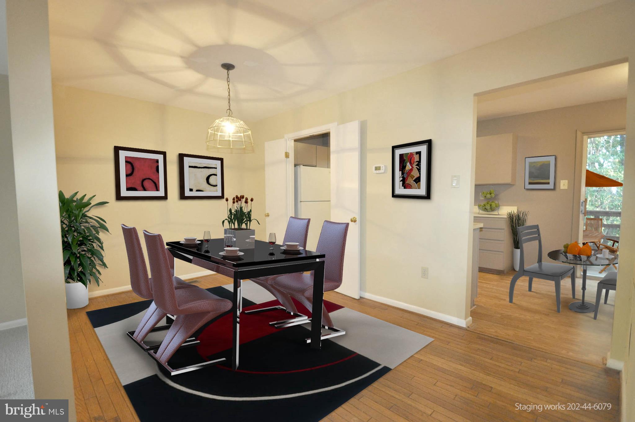 9125 Saffron Lane Silver Spring, MD 20901 - Photo 6 of 18 a view of a dining room with furniture and wooden floor