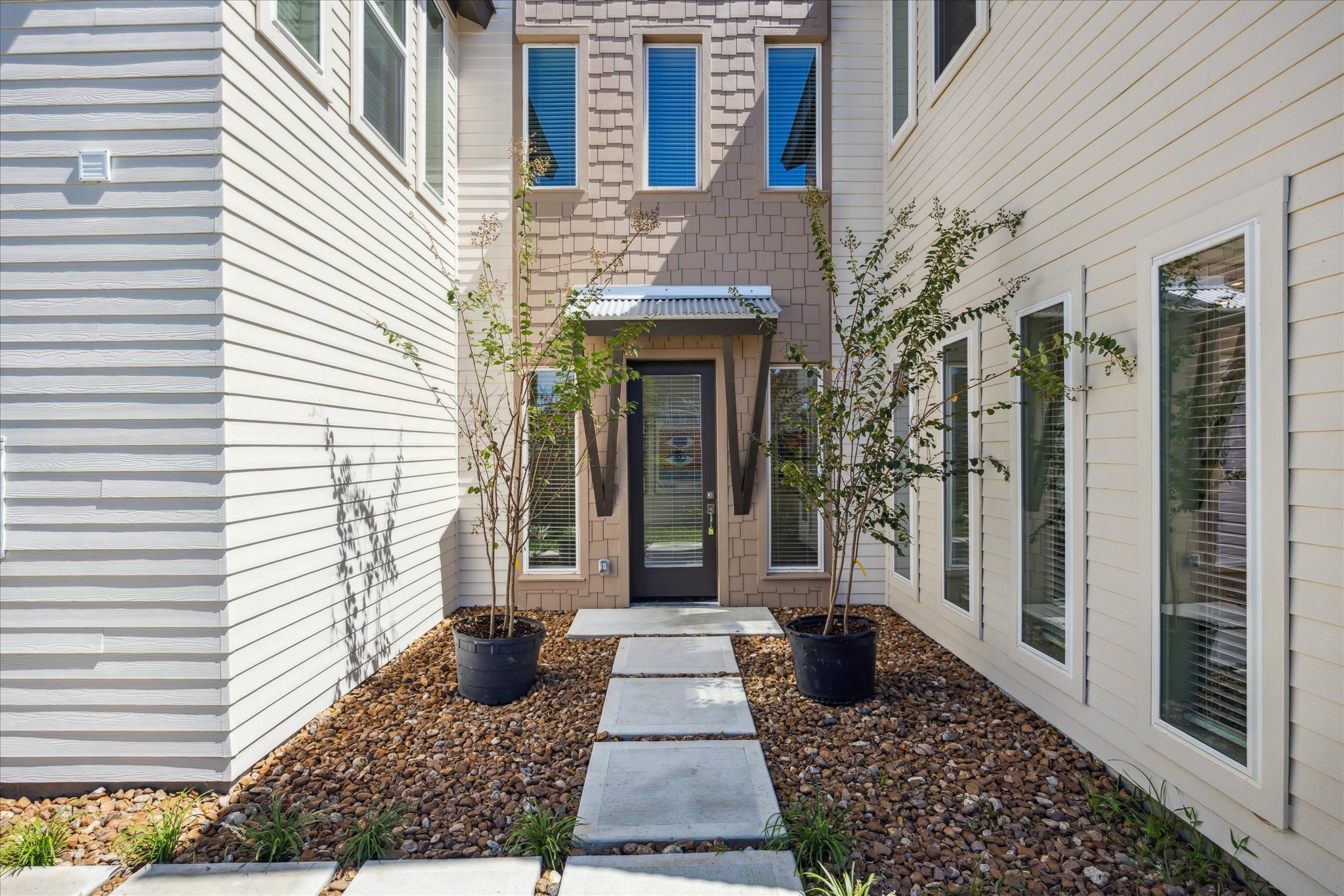 5903 Urban Pines Street Houston, TX 77091 - Photo 2 of 42 a view of a brick house with large windows