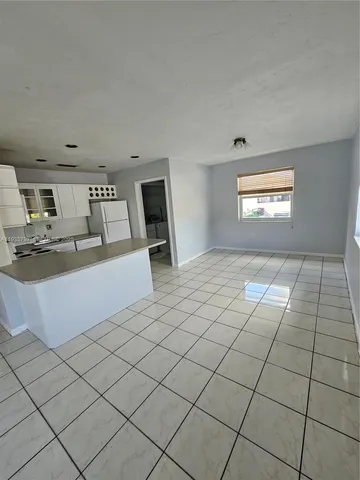 a view of a livingroom with furniture
