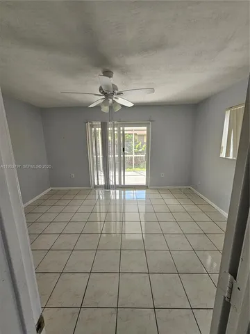 a bathroom with a toilet a sink a shower and mirror