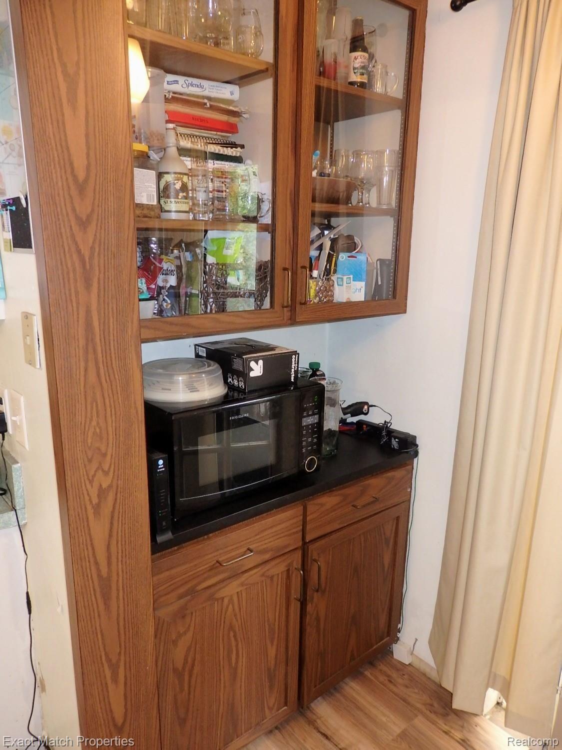 1392 Delta Road Walled Lake, MI 48390 - Photo 26 of 48 Handy extra storage and counter