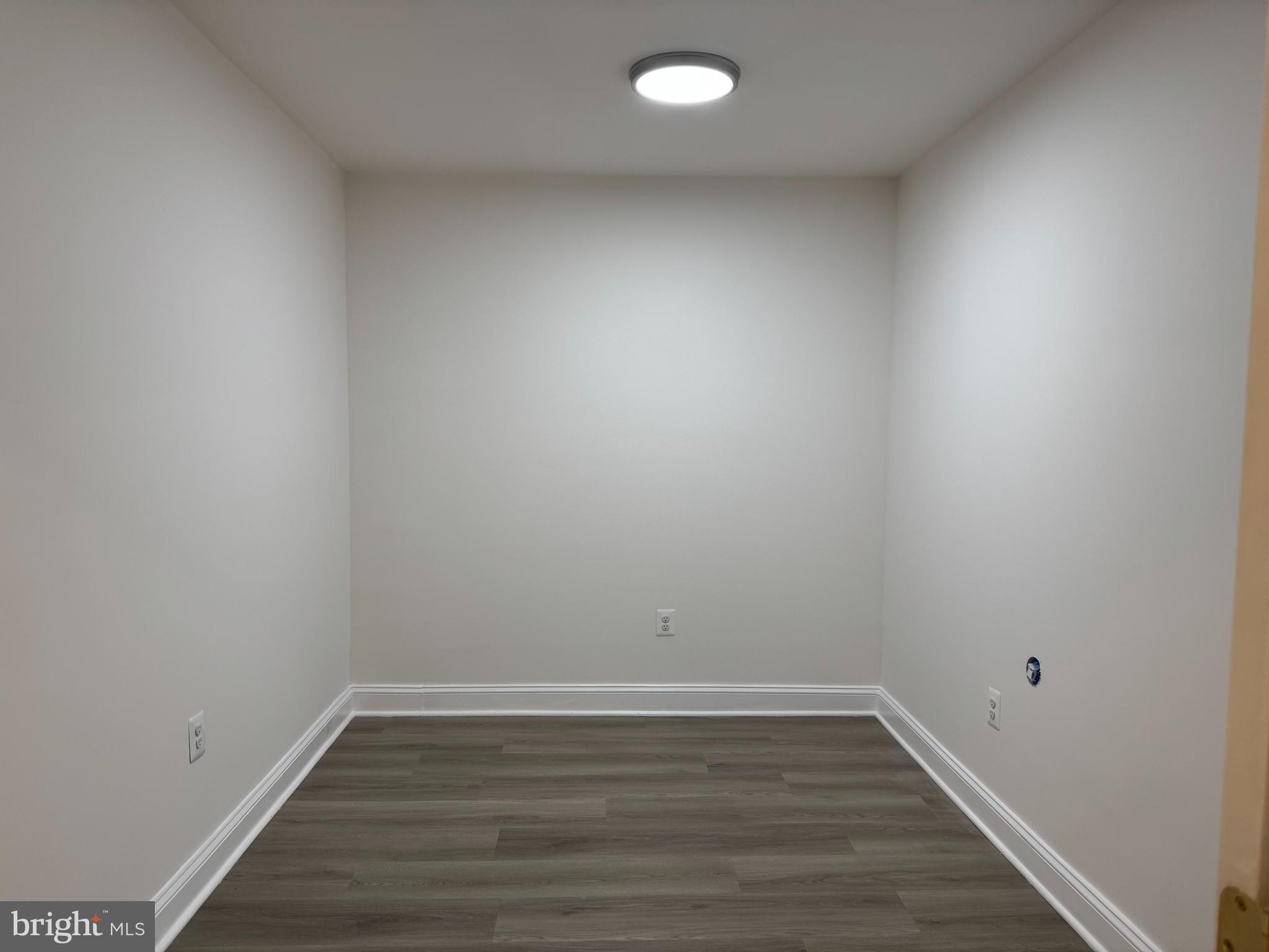 5318 Gay Street Northeast Washington, DC 20019 - Photo 12 of 14 a view of an empty room and wooden floor