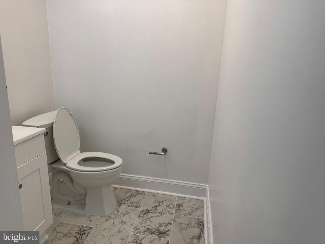 5318 Gay Street Northeast Washington, DC 20019 - Photo 14 of 14 a white toilet sitting next to a shower