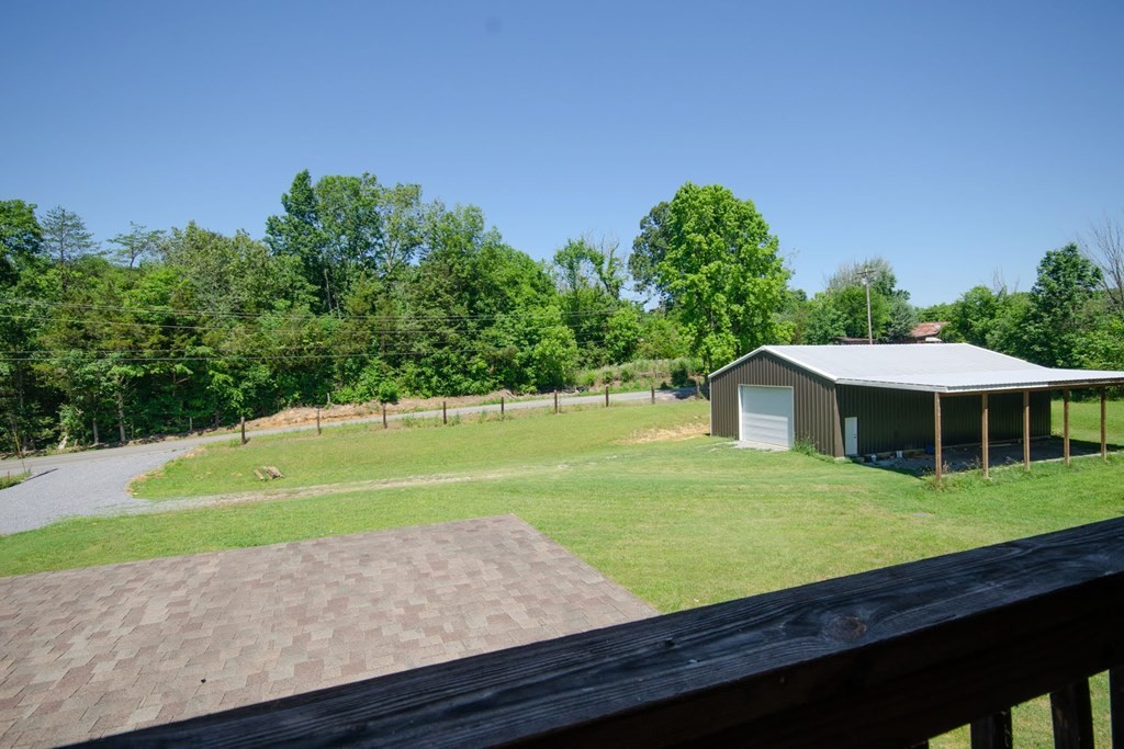 767 Lane Hollow Road Sevierville, TN 37876 - Photo 31 of 31 a view of a house with a yard and large trees