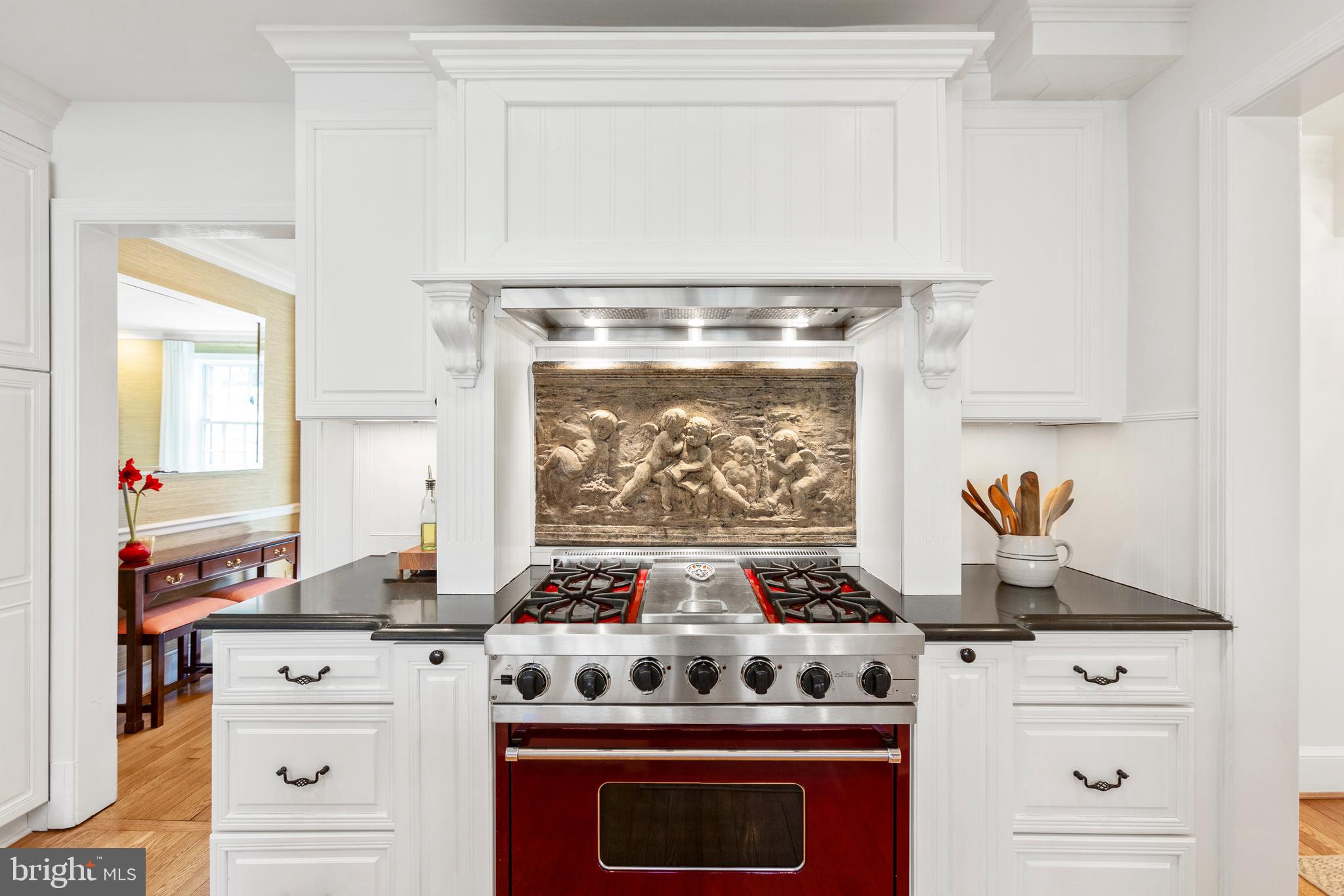 3303 Rolling Road Chevy Chase, MD 20815 - Photo 13 of 51 a stove top oven sitting inside of a kitchen