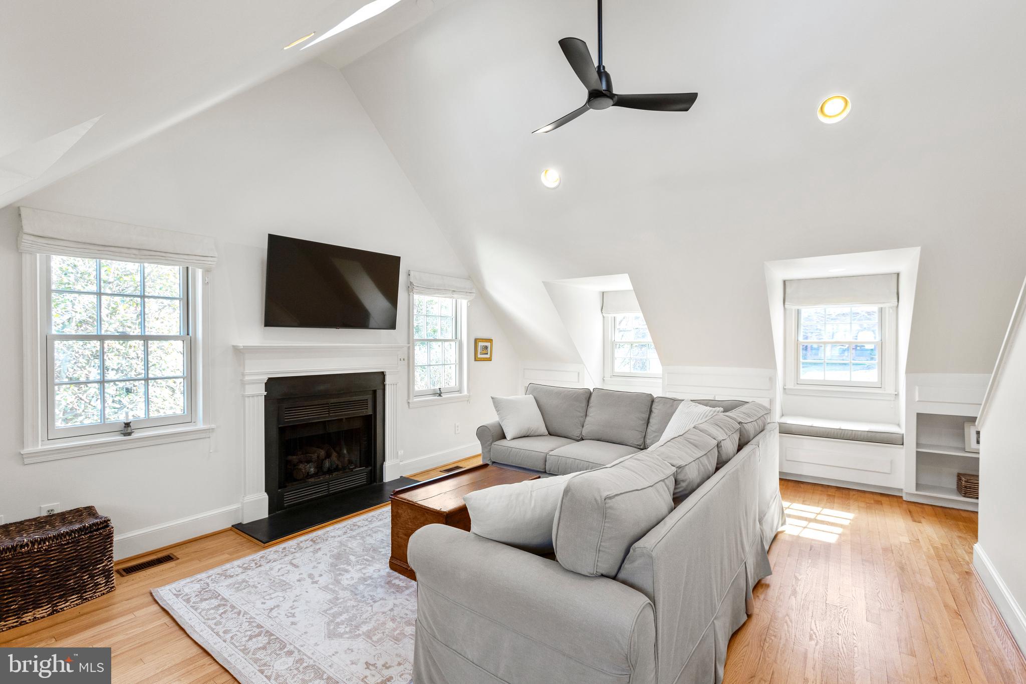 3303 Rolling Road Chevy Chase, MD 20815 - Photo 15 of 51 a living room with furniture and a fireplace