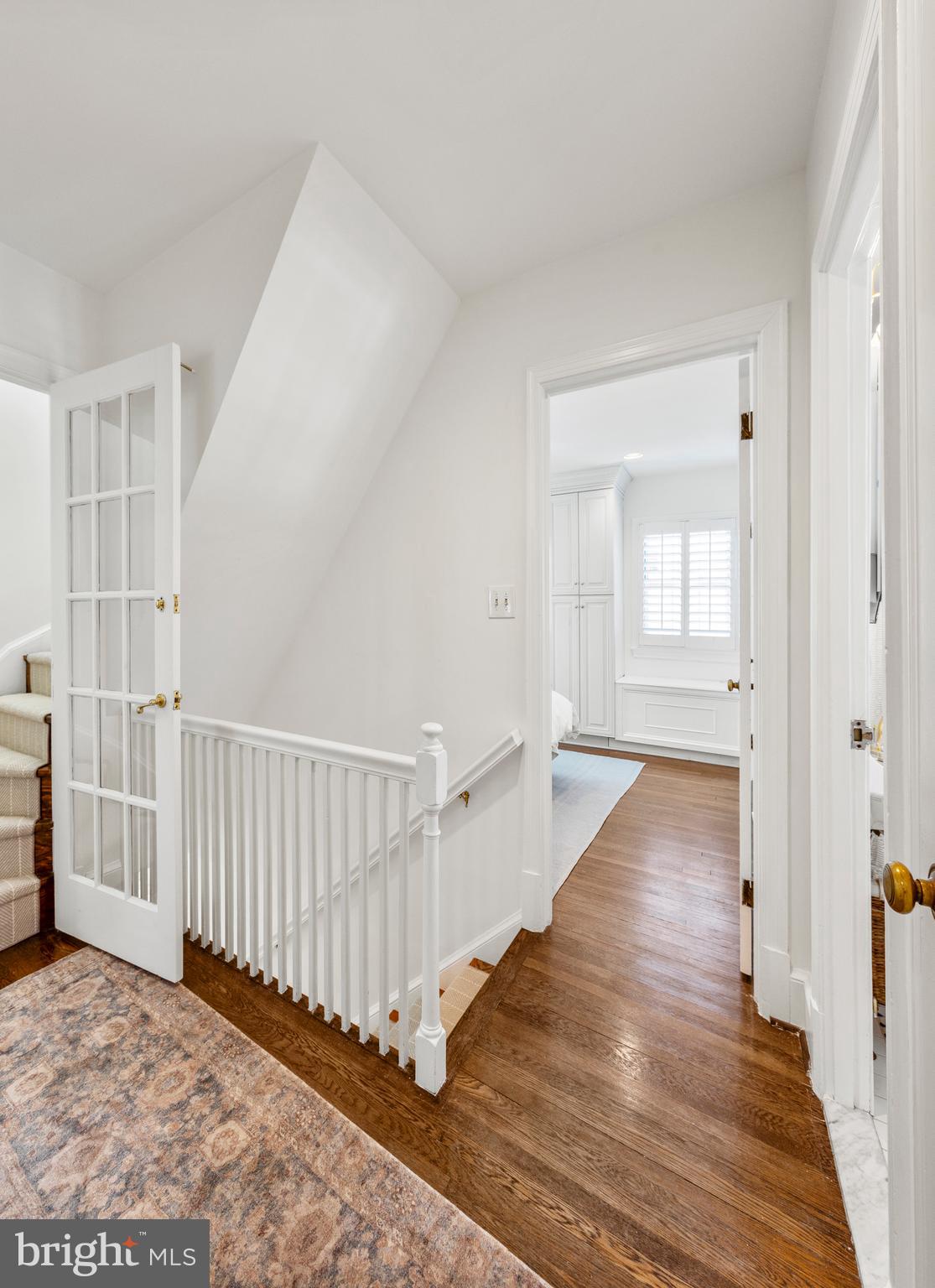 3303 Rolling Road Chevy Chase, MD 20815 - Photo 19 of 51 a view of a hallway with wooden floor and windows