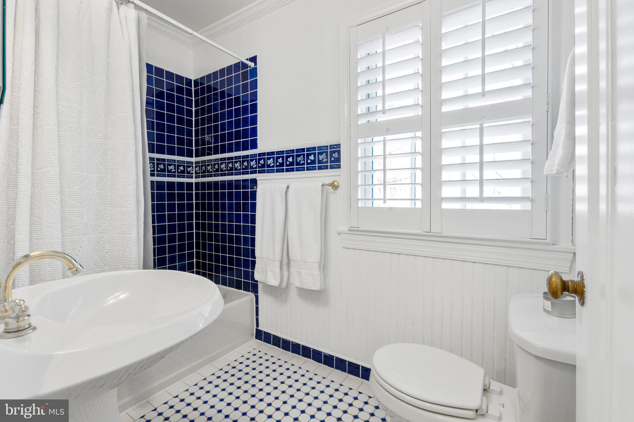 3303 Rolling Road Chevy Chase, MD 20815 - Photo 25 of 51 a bathroom with a sink toilet and shower