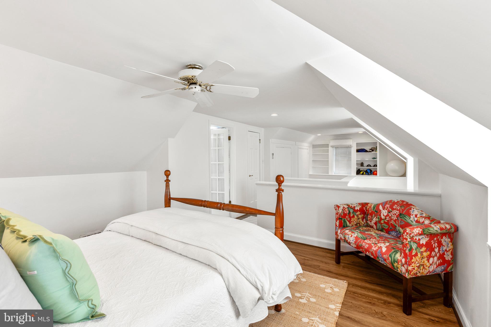 3303 Rolling Road Chevy Chase, MD 20815 - Photo 28 of 51 a bedroom with a bed and a chandelier